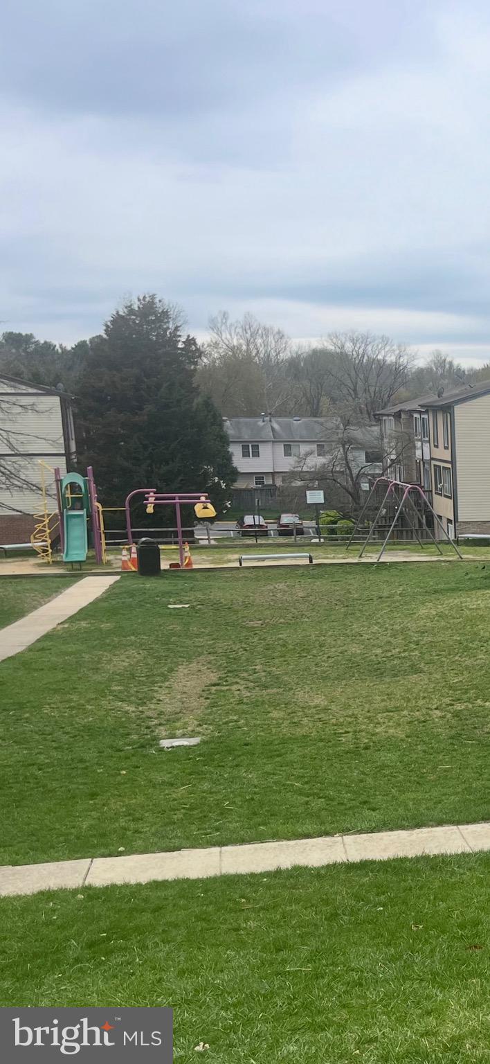 2346 Sun Valley Circle, Unit 2A Silver Spring, MD 20906 - Photo 21 of 21 a view of a lake with houses in the background