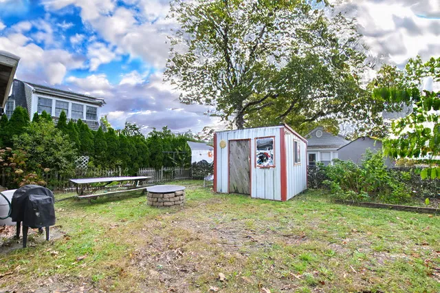 a view of a chairs in a backyard