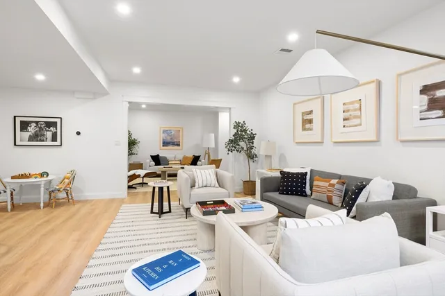 a living room with furniture or couch and a dining table