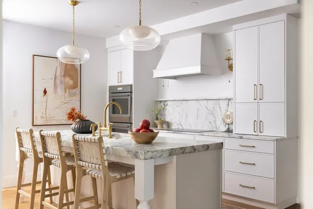 a kitchen with a sink cabinets and window