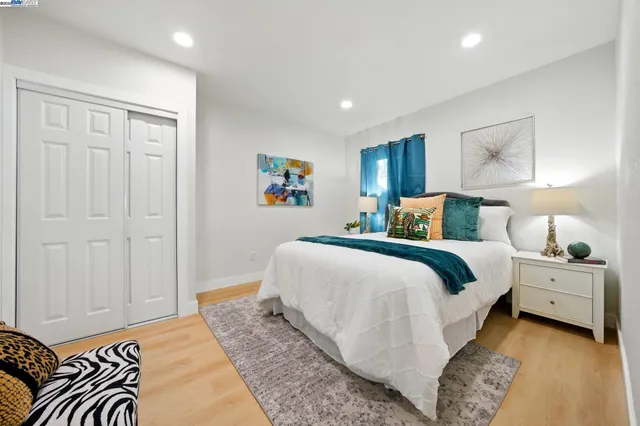 a white toilet sitting next to a bathroom sink and tub