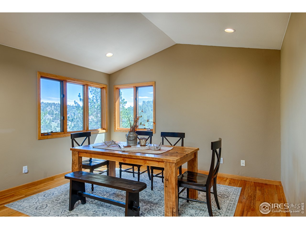112 Bow Mountain Road Boulder, CO 80304 - Photo 10 of 40 a dining room with furniture and window
