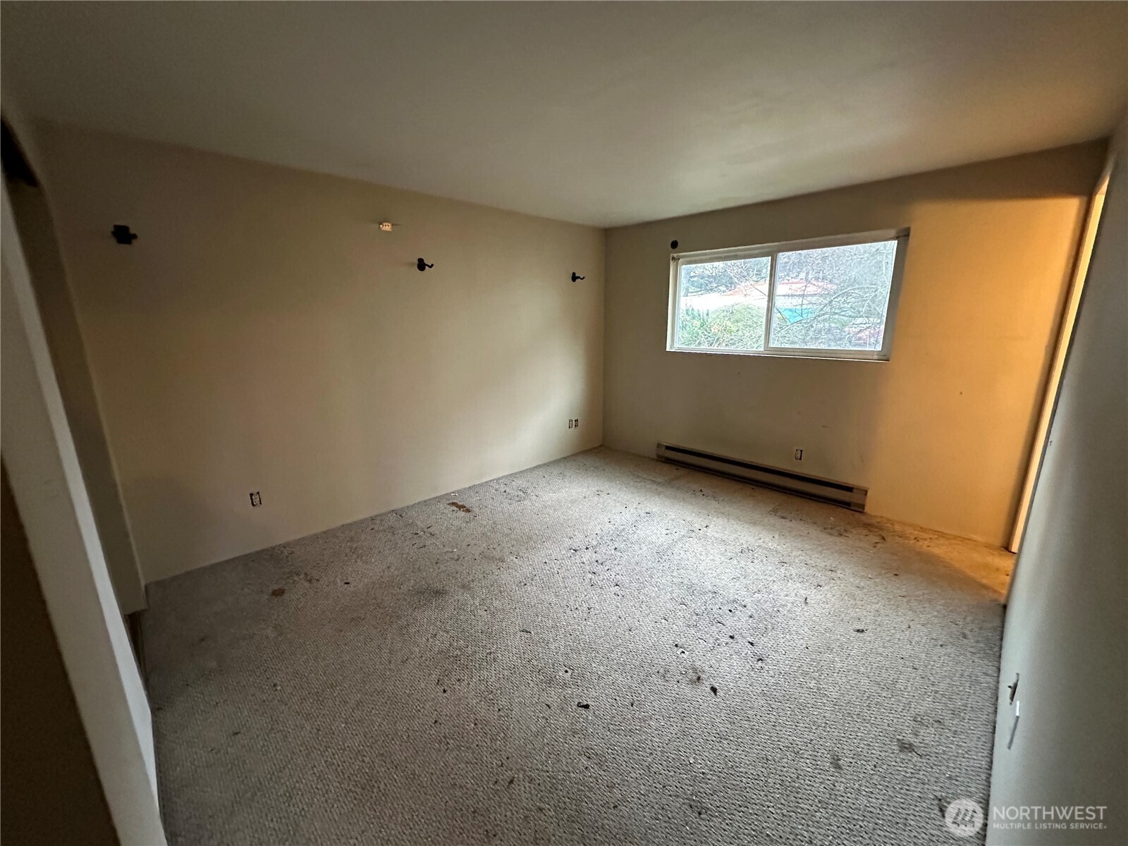 15210 Macadam Road South, Unit D301 Tukwila, WA 98188 - Photo 9 of 12 a view of an empty room with a window