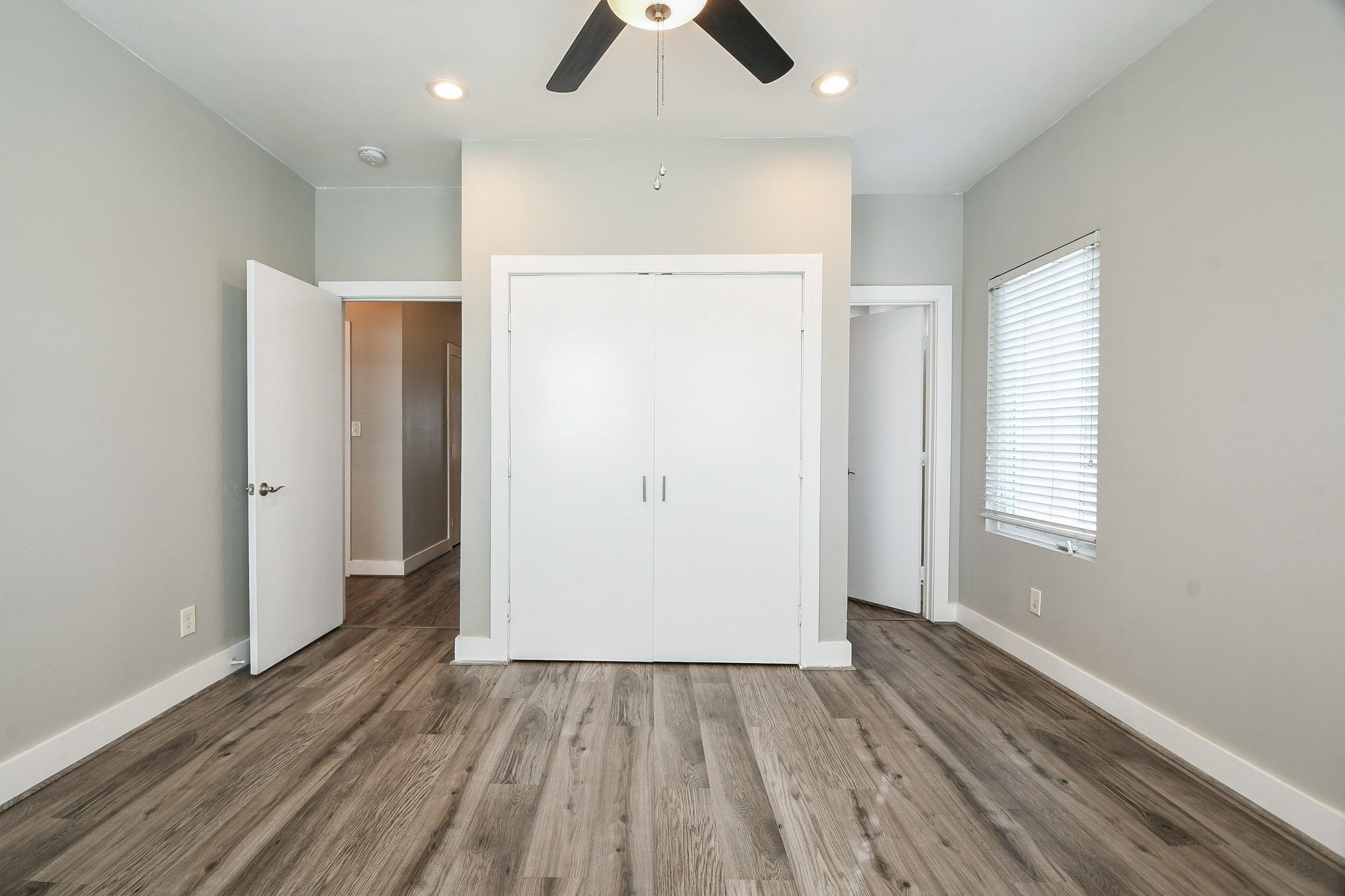 3249 Dixie Drive, Unit B Houston, TX 77021 - Photo 10 of 25 wooden floor in an empty room with a window
