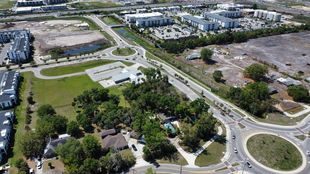 6480 Richardson Road Sarasota, FL 34240 - Photo 5 of 6 an aerial view of residential houses with outdoor space and trees