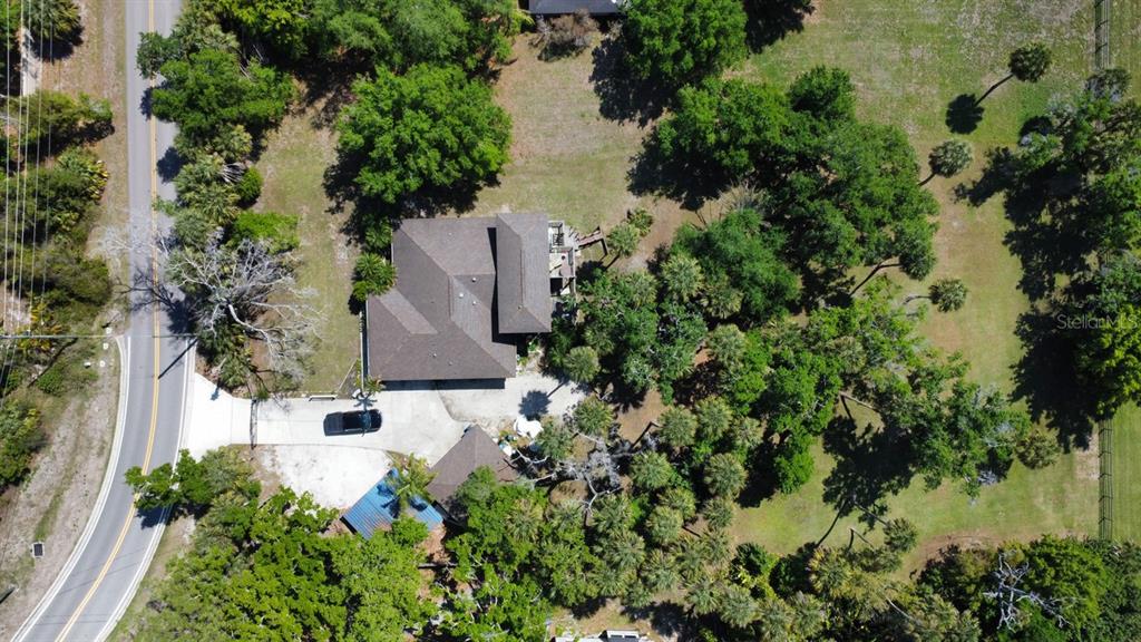 6480 Richardson Road Sarasota, FL 34240 - Photo 6 of 6 an aerial view of residential house with outdoor space and trees all around