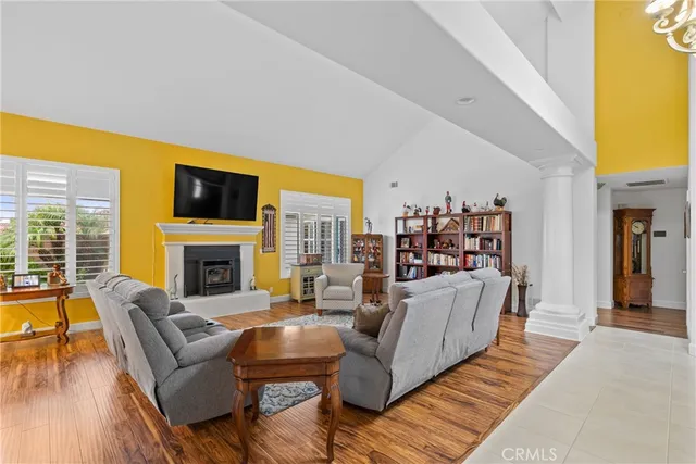 a living room with furniture fireplace and flat screen tv
