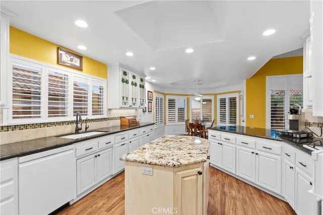 a kitchen with center island and windows