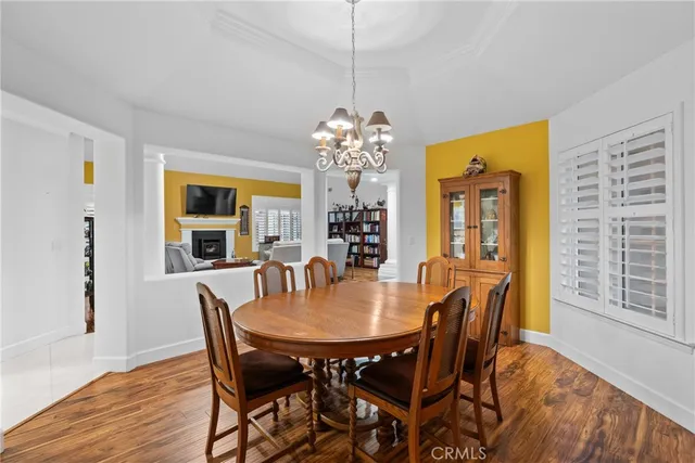 a view of a dining room with furniture and window