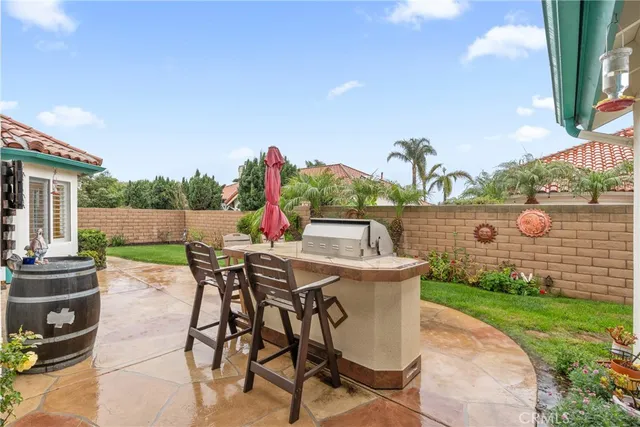 a view of a patio with table and chairs and potted plants