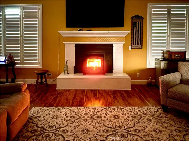 a living room with a couch and a fireplace