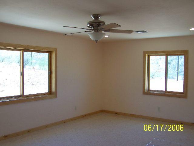 1561 Ovalo Court Rio Rico, AZ 85648 - Photo 5 of 9 an empty room with a window