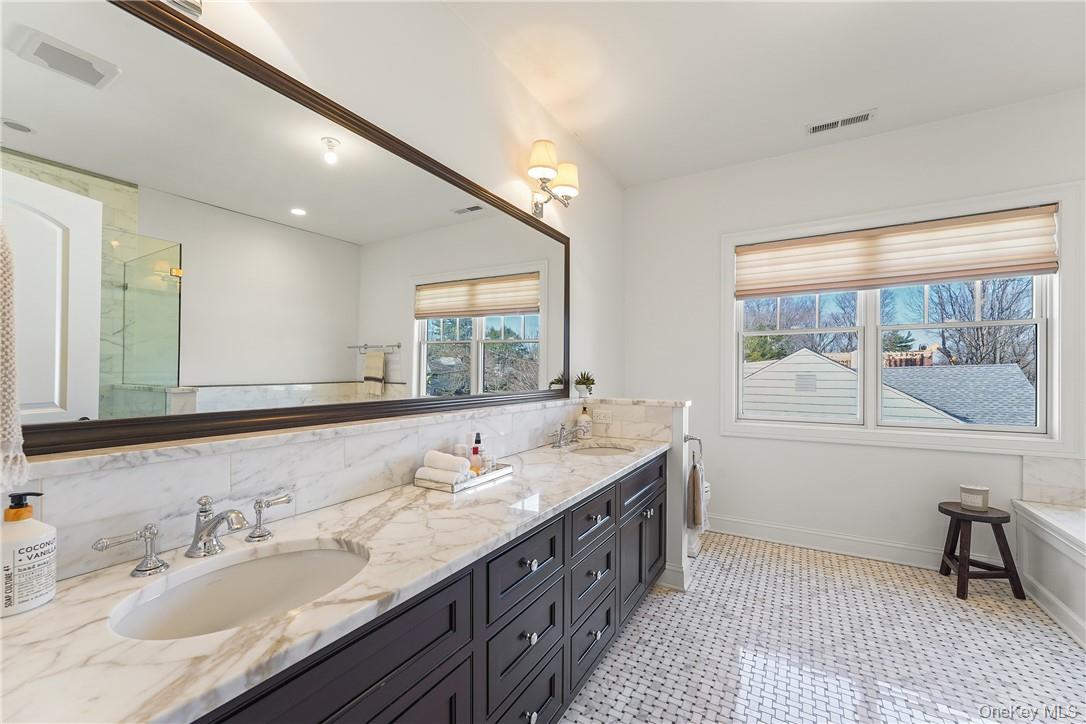 81 Spier Road Scarsdale, NY 10583 - Photo 14 of 32 Luxurious Primary bathroom with double sinks