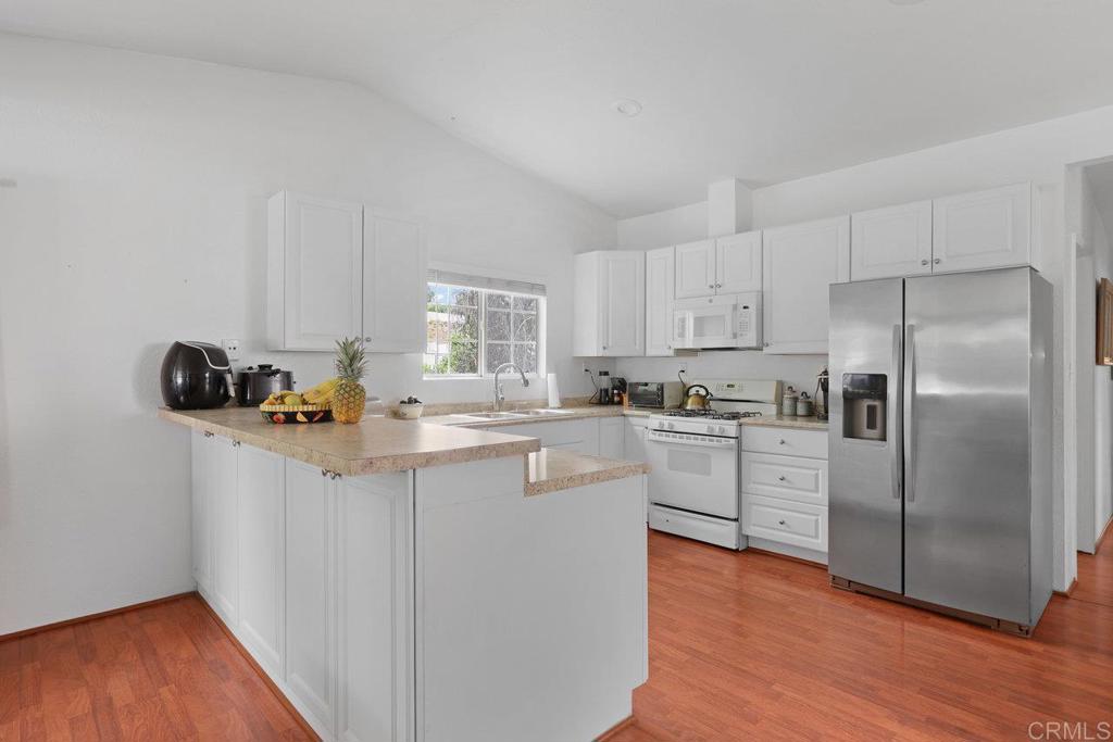 8968 Lakeview Road Lakeside, CA 92040 - Photo 15 of 30 a kitchen with stainless steel appliances a refrigerator and a sink