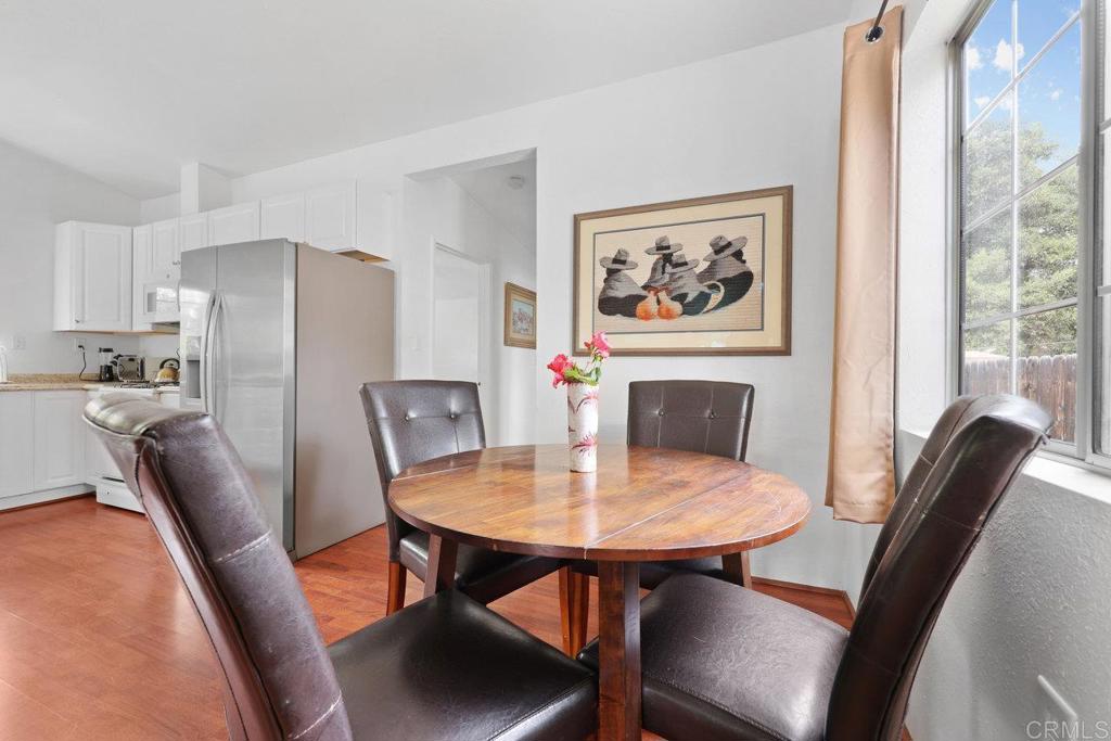 8968 Lakeview Road Lakeside, CA 92040 - Photo 18 of 30 a view of a dining room with furniture window and wooden floor