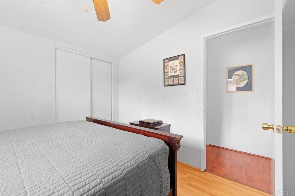 8968 Lakeview Road Lakeside, CA 92040 - Photo 20 of 30 a bedroom with a bed and a painting on the wall