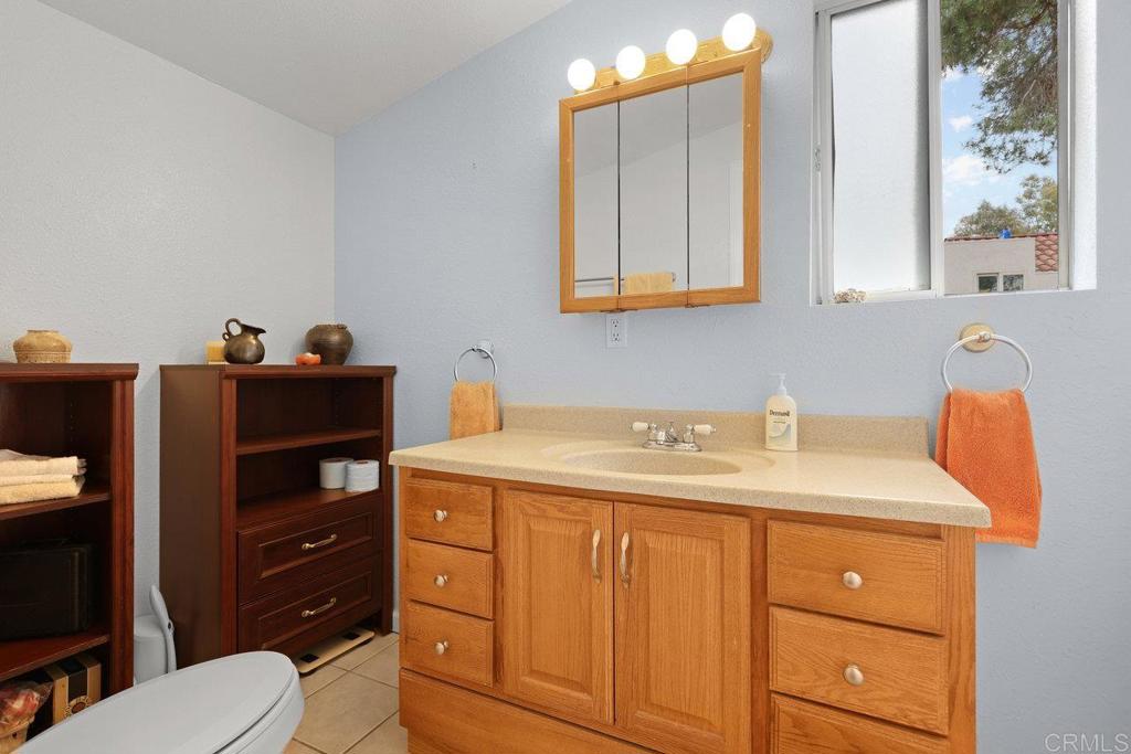 8968 Lakeview Road Lakeside, CA 92040 - Photo 21 of 30 a bathroom with a sink vanity and mirror