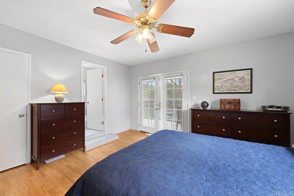 8968 Lakeview Road Lakeside, CA 92040 - Photo 24 of 30 a bedroom with a bed and a dresser