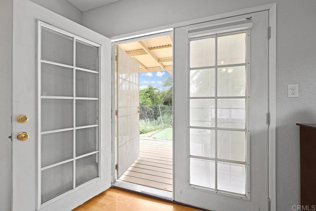 8968 Lakeview Road Lakeside, CA 92040 - Photo 25 of 30 a view of a room with wooden floor and windows