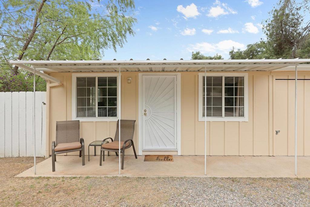 8968 Lakeview Road Lakeside, CA 92040 - Photo 3 of 30 a view of a patio with table and chairs and potted plants