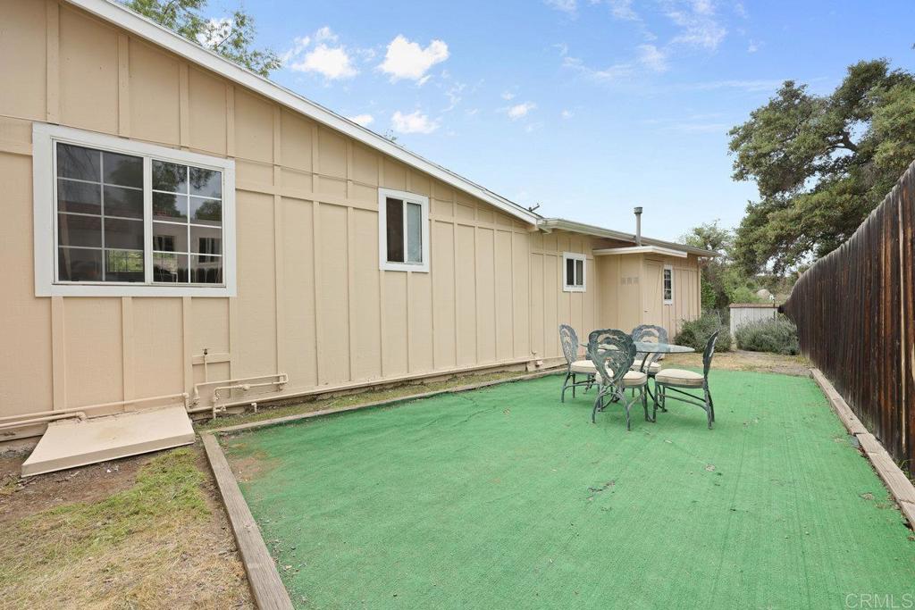 8968 Lakeview Road Lakeside, CA 92040 - Photo 4 of 30 a view of a backyard with table and chairs and a barbeque