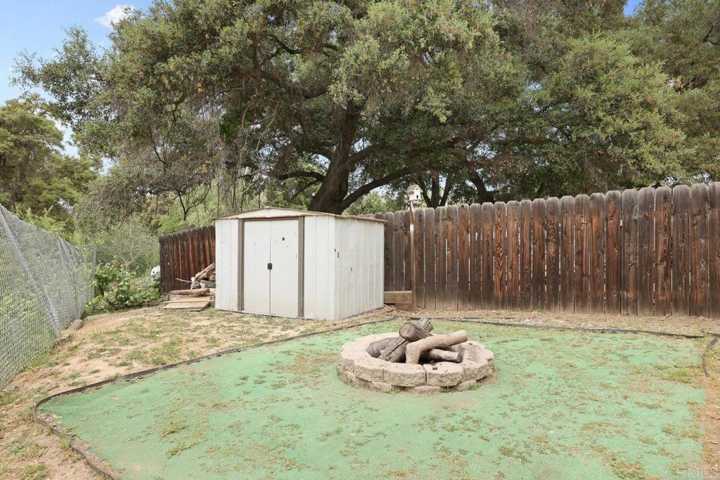 8968 Lakeview Road Lakeside, CA 92040 - Photo 8 of 30 a backyard of a house with table and chairs