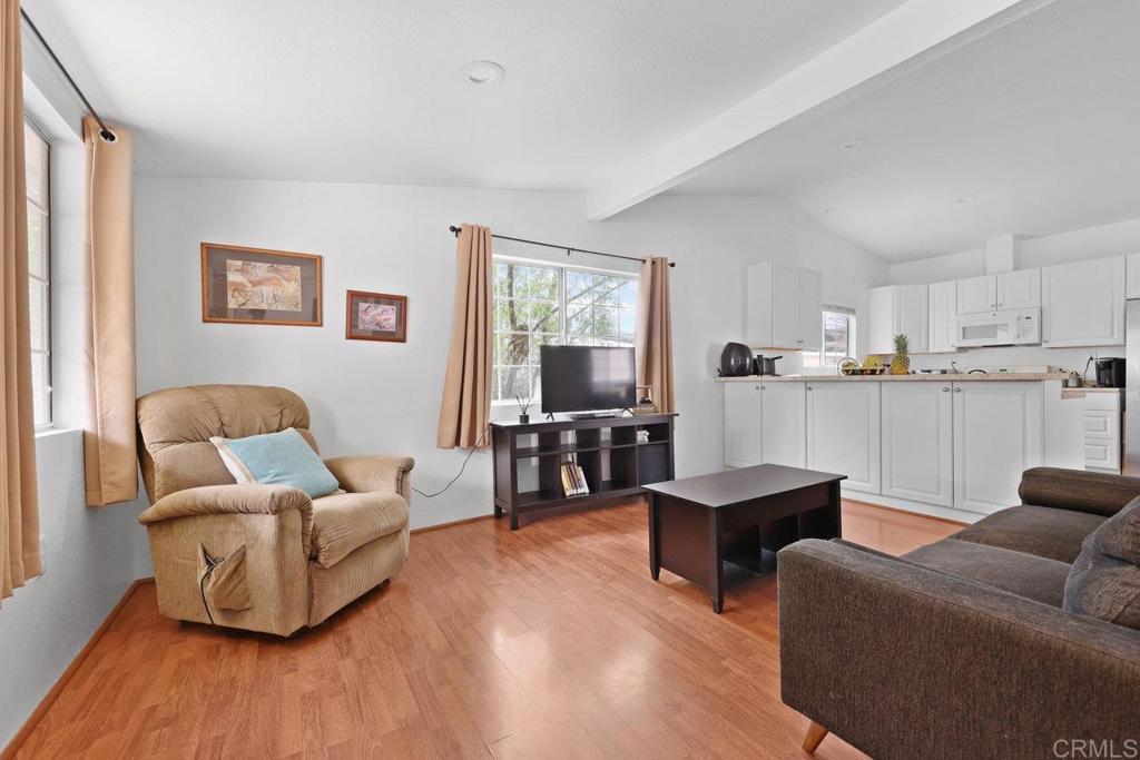 8968 Lakeview Road Lakeside, CA 92040 - Photo 10 of 30 a living room with furniture wooden floor and kitchen view