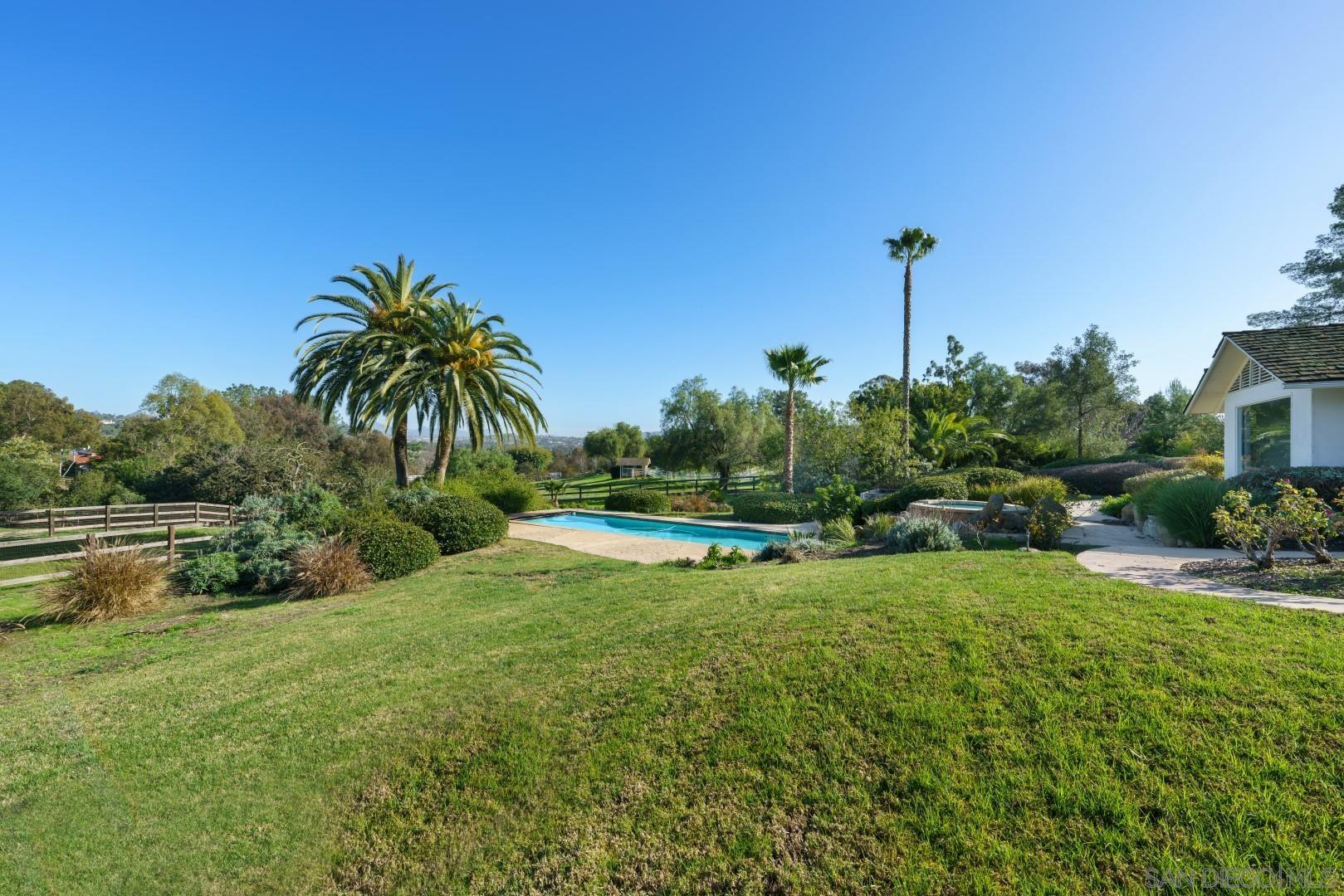 6531 Lago Lindo Rancho Santa Fe, CA 92067 - Photo 24 of 54 a view of a garden with a lake view