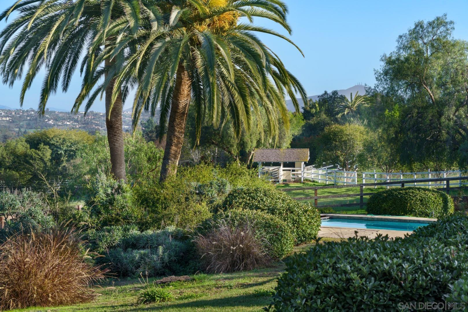 6531 Lago Lindo Rancho Santa Fe, CA 92067 - Photo 33 of 54 a view of backyard with swimming pool and outdoor seating