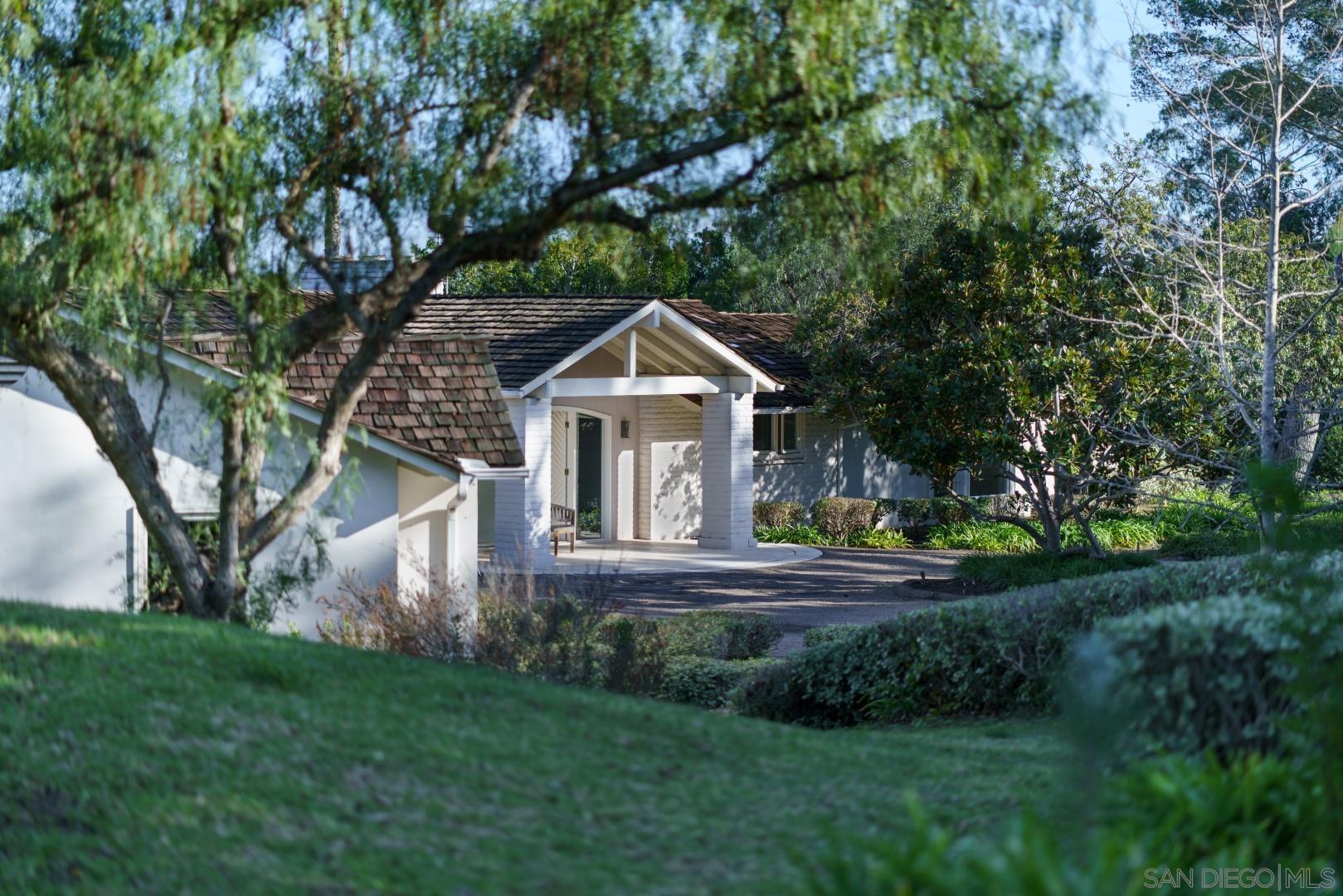 6531 Lago Lindo Rancho Santa Fe, CA 92067 - Photo 43 of 54 a front view of house with yard and green space
