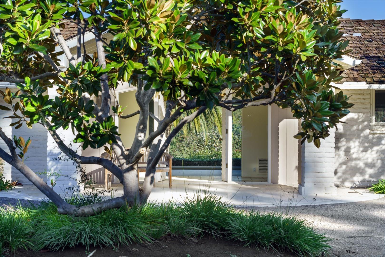 6531 Lago Lindo Rancho Santa Fe, CA 92067 - Photo 44 of 54 a view of a yard in front of a house with large tree