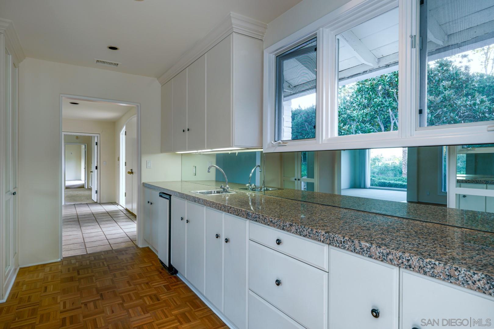6531 Lago Lindo Rancho Santa Fe, CA 92067 - Photo 8 of 54 a kitchen with a sink and large window