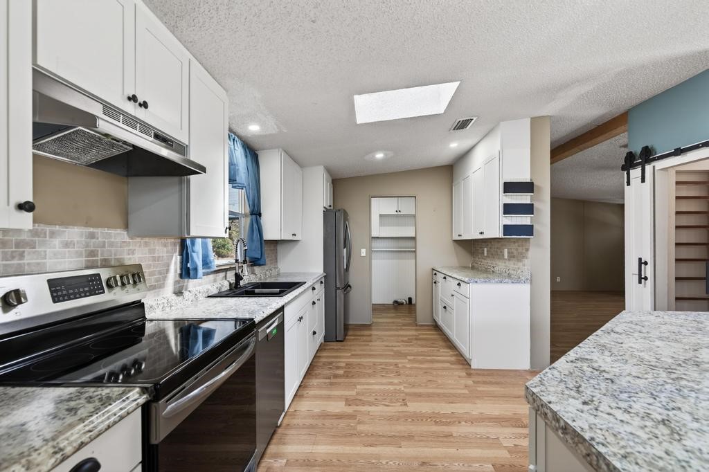 2744 Roy Sikes Road Hilliard, FL 32046 - Photo 24 of 97 a kitchen with a stove and a kitchen