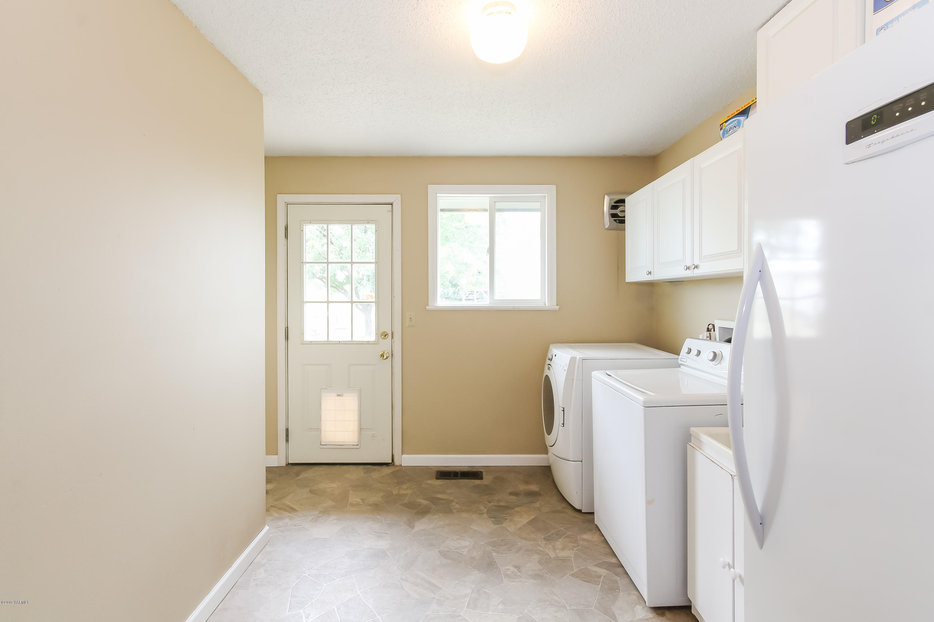 120 Martin Road Toppenish, WA 98948 - Photo 22 of 36 a view of a room with refrigerator washer and dryer