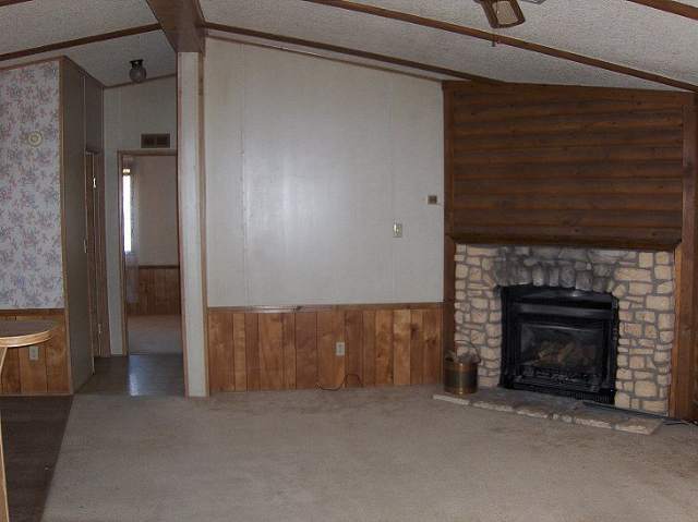 71 West 3rd Street Eagar, AZ 85925 - Photo 2 of 5 a room with fireplace and a fireplace