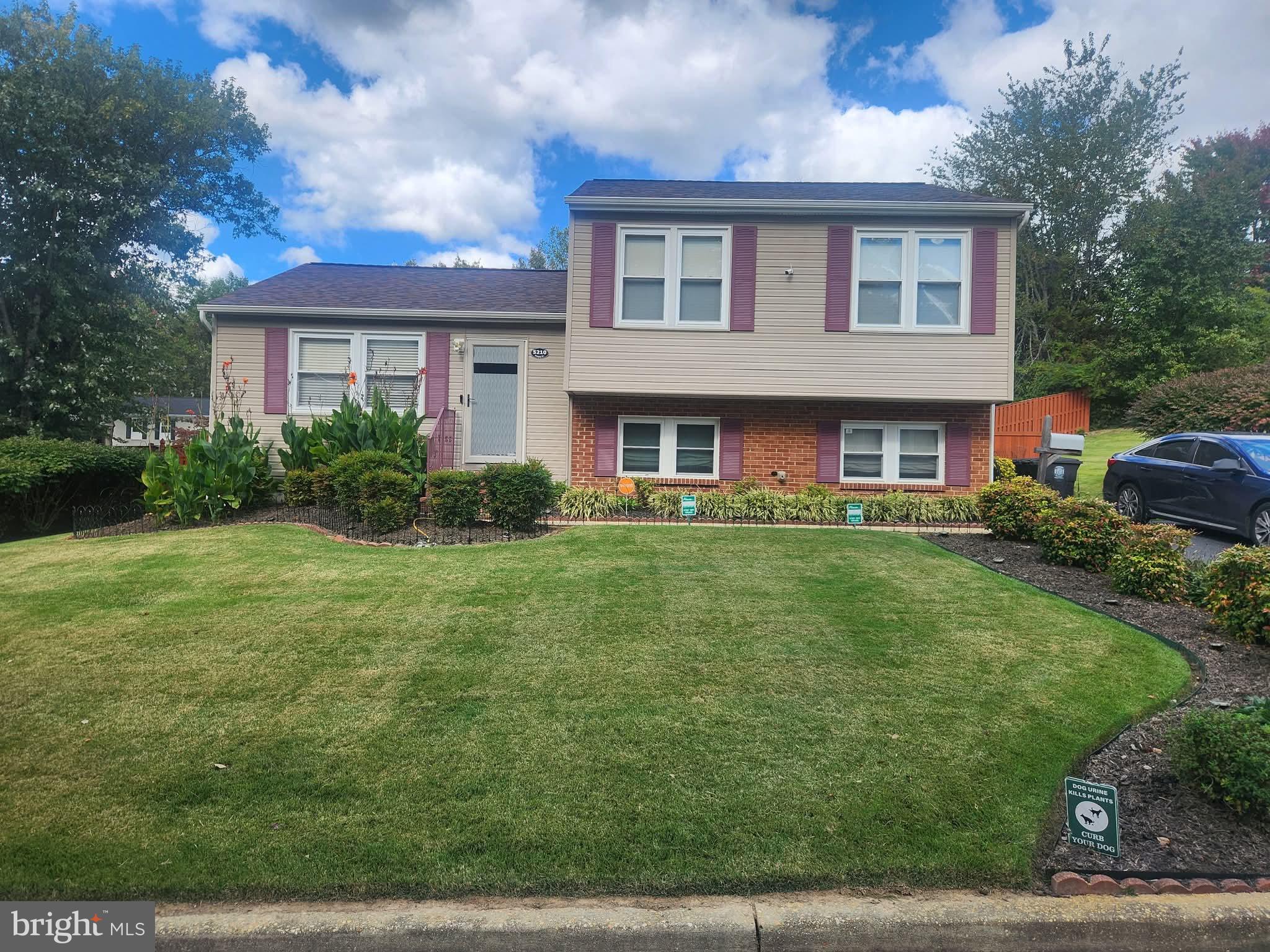 5210 Vienna Drive Clinton, MD 20735 - Photo 1 of 1 a front view of a house with garden