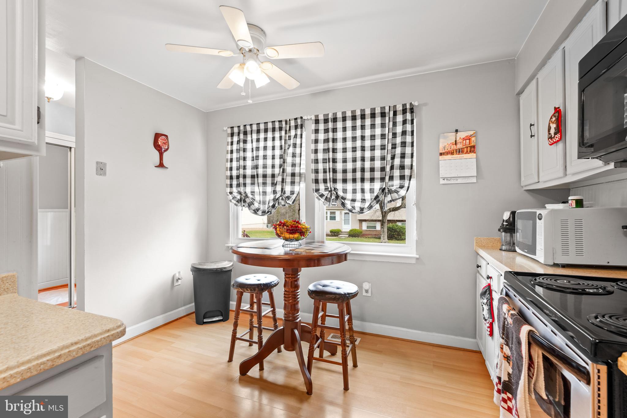 5210 Vienna Drive Clinton, MD 20735 - Photo 13 of 29 a kitchen with stainless steel appliances granite countertop a stove a sink dishwasher and a refrigerator with wooden floor