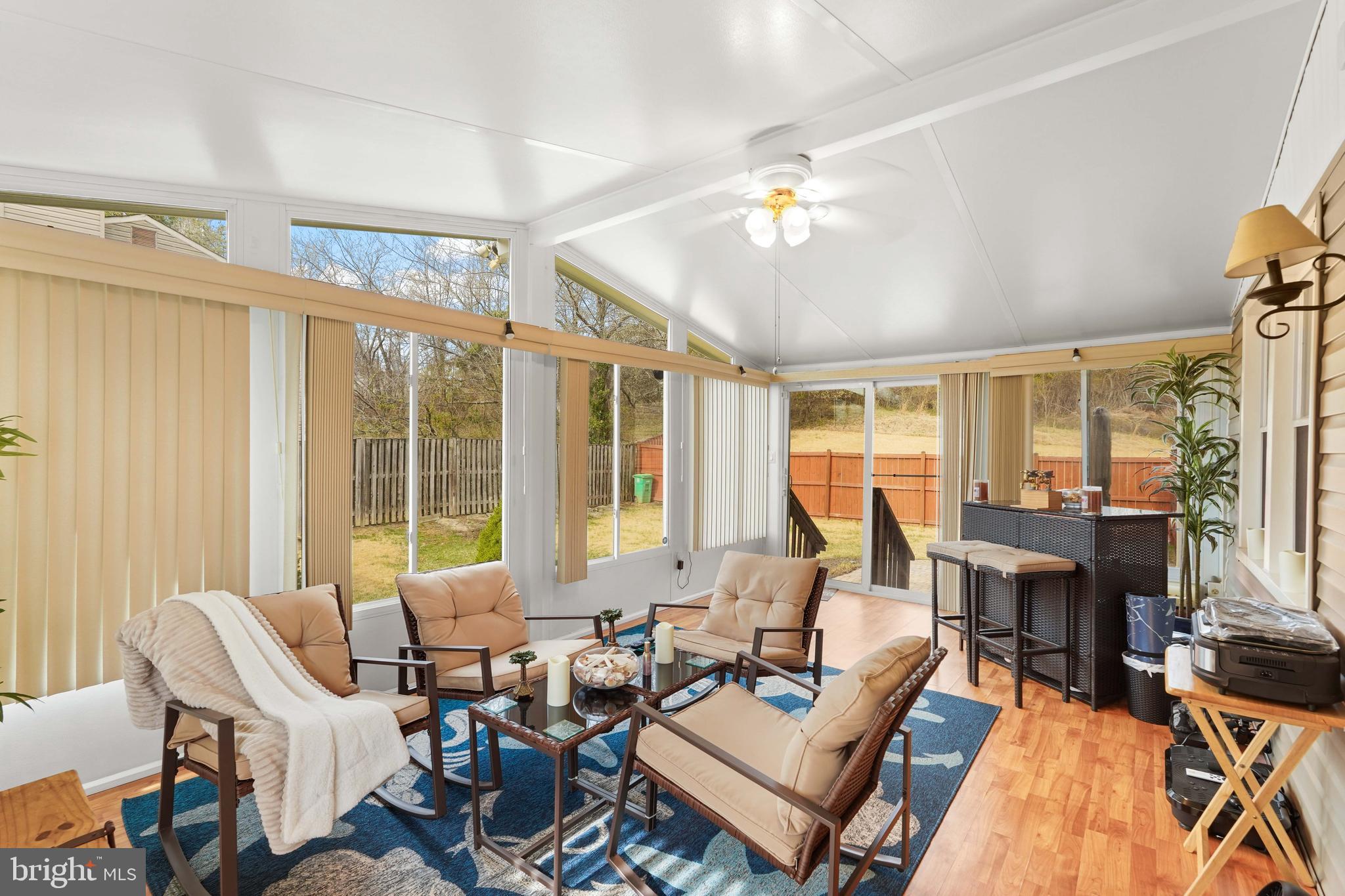 5210 Vienna Drive Clinton, MD 20735 - Photo 14 of 29 a living room with furniture kitchen view and large windows