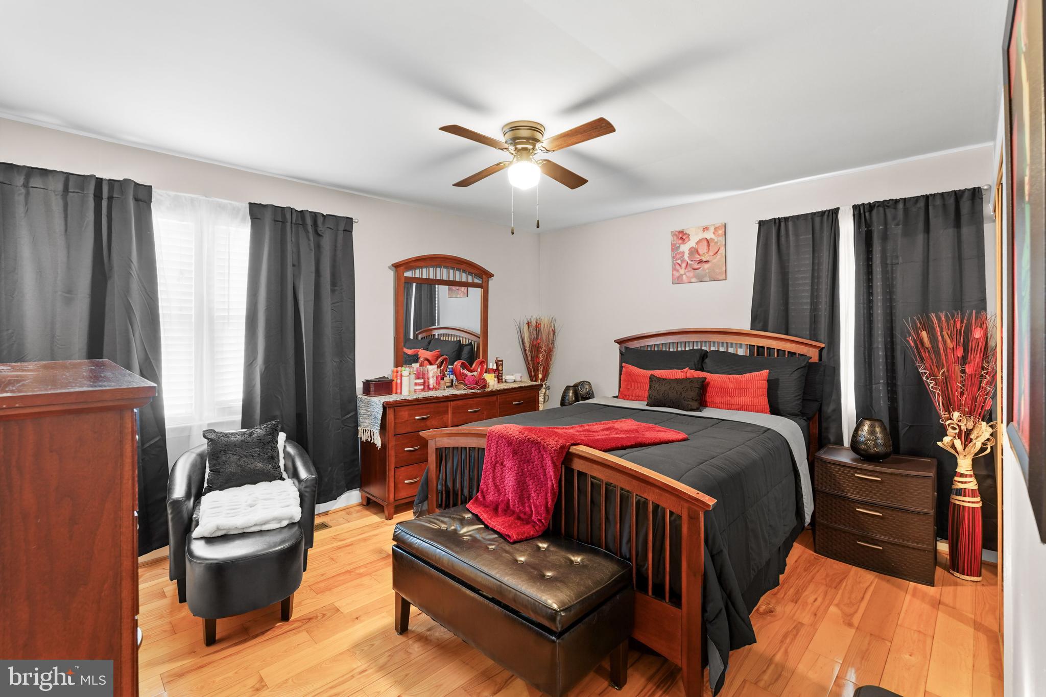 5210 Vienna Drive Clinton, MD 20735 - Photo 17 of 29 a bedroom with a bed and a chandelier