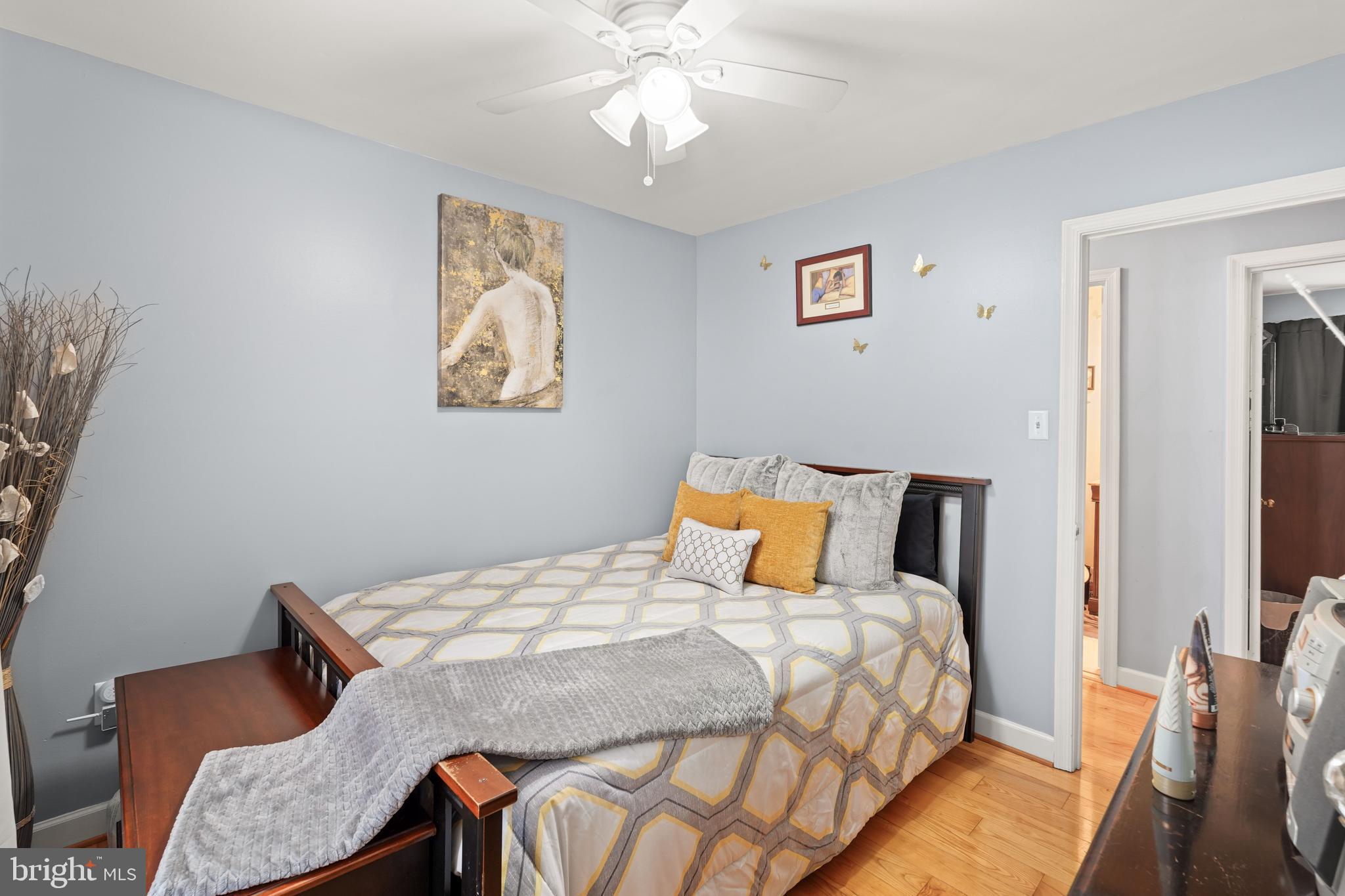 5210 Vienna Drive Clinton, MD 20735 - Photo 22 of 29 a bedroom with a bed and a chandelier