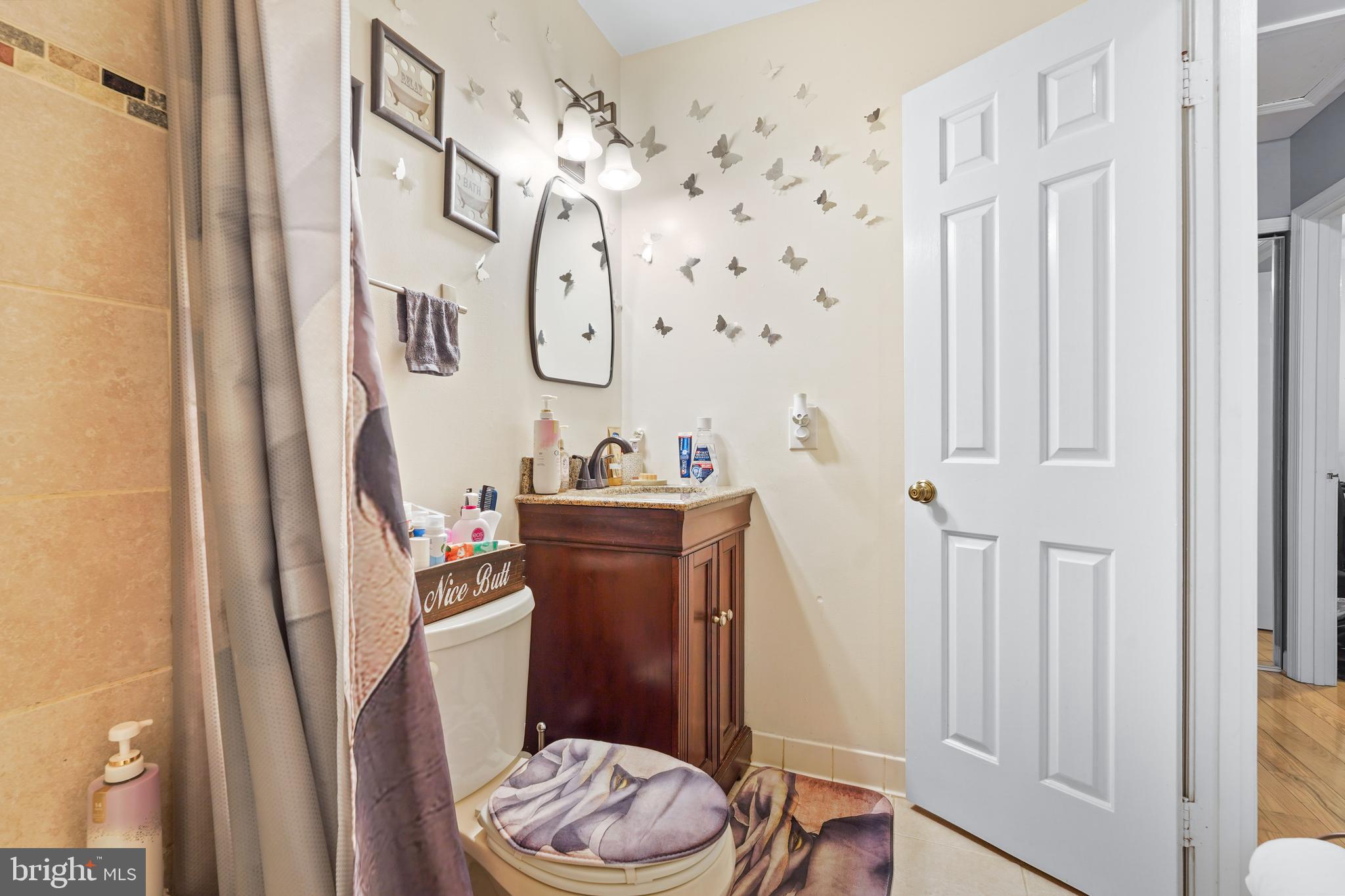5210 Vienna Drive Clinton, MD 20735 - Photo 25 of 29 a bathroom with a sink toilet and shower