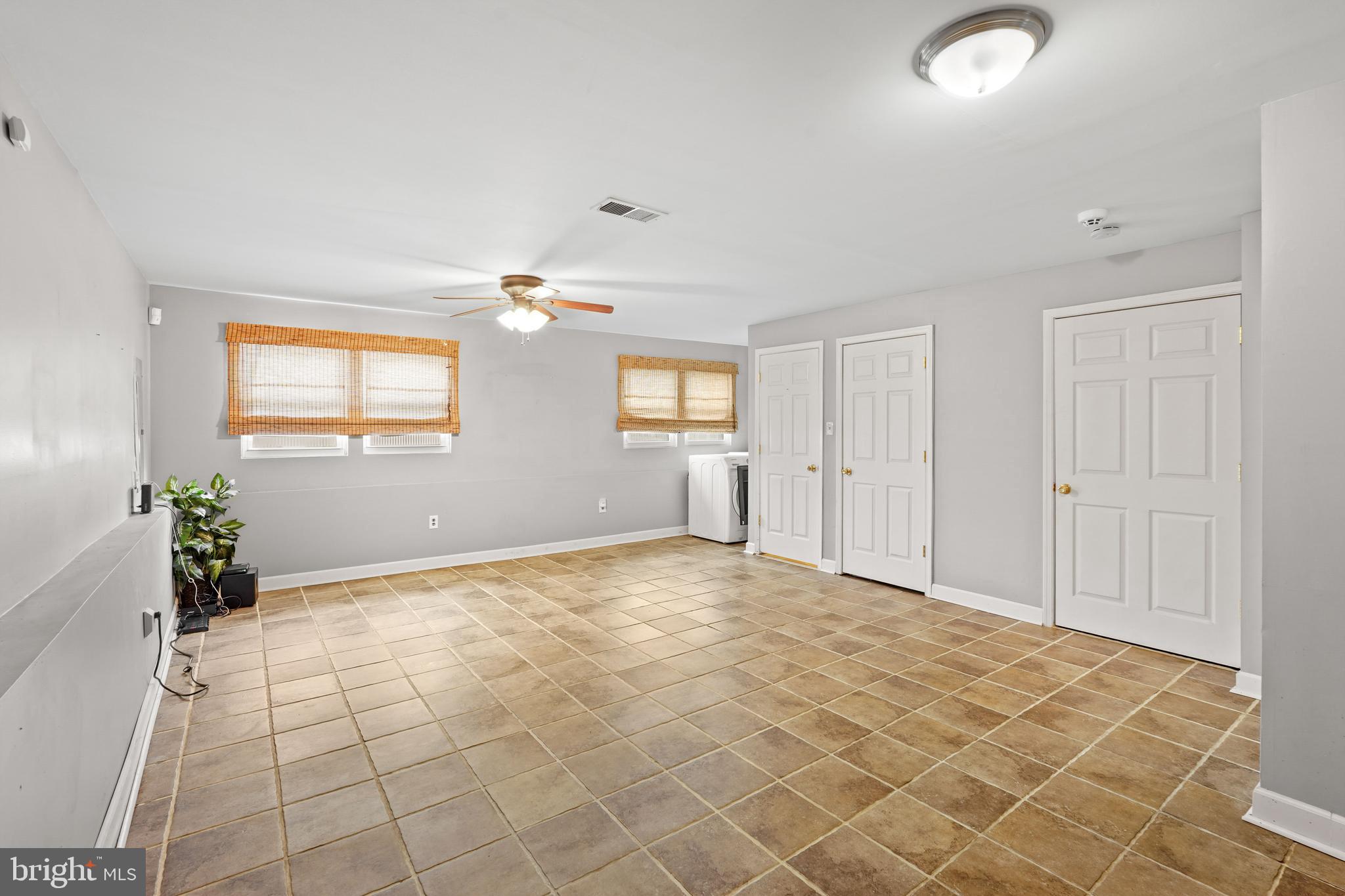 5210 Vienna Drive Clinton, MD 20735 - Photo 26 of 29 an empty room with windows and entrance