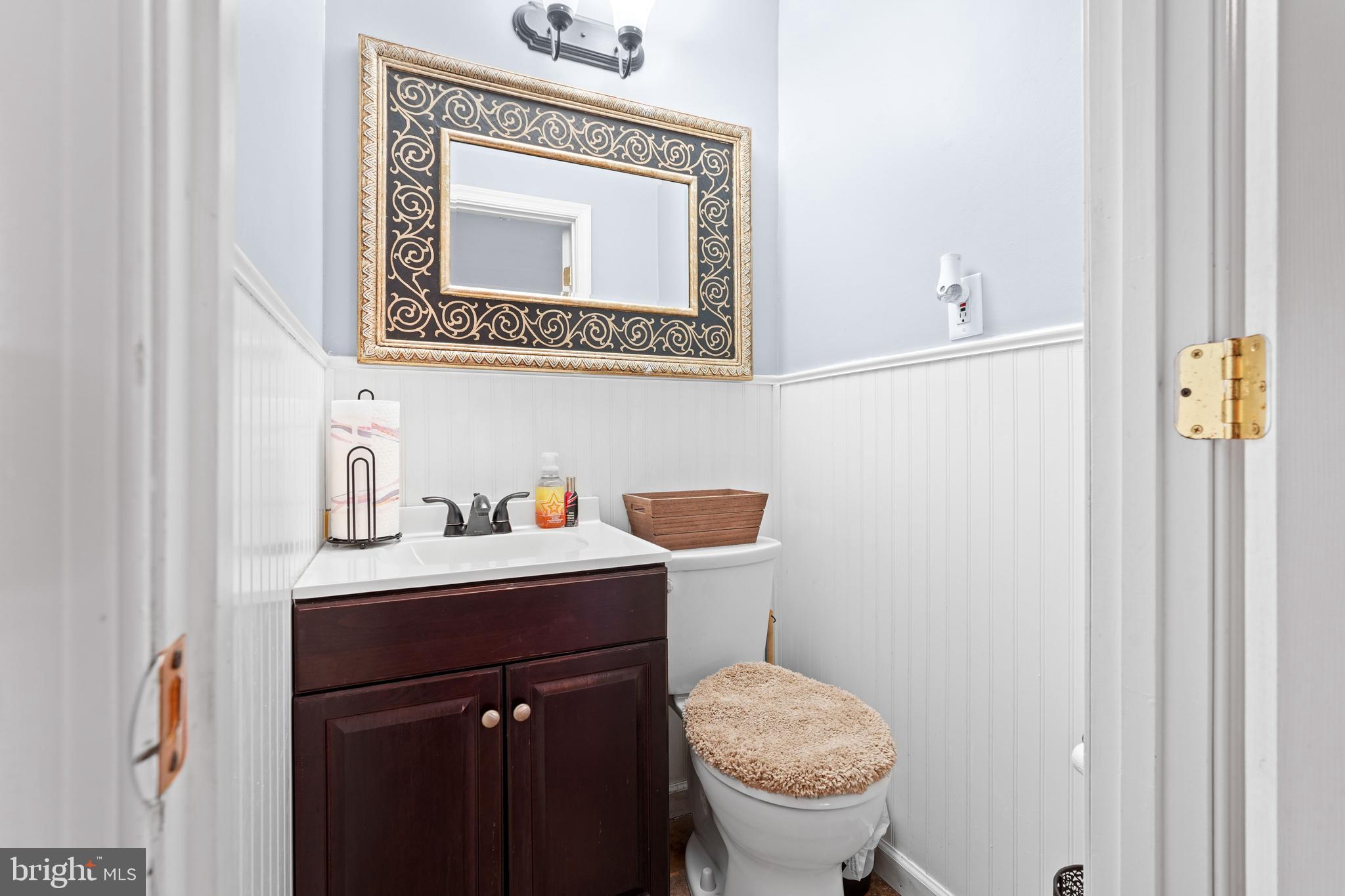 5210 Vienna Drive Clinton, MD 20735 - Photo 27 of 29 a bathroom with a toilet a sink and mirror