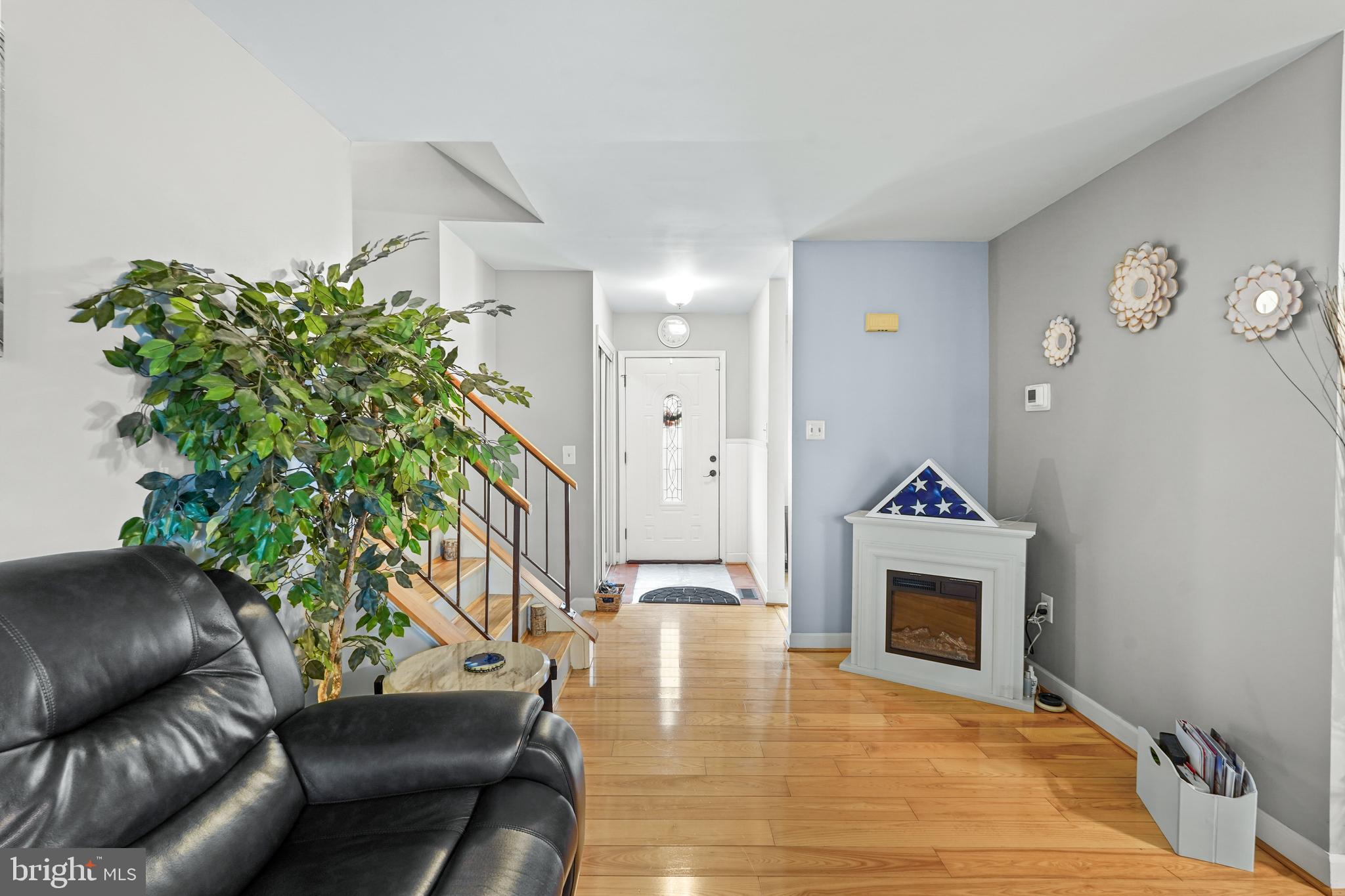 5210 Vienna Drive Clinton, MD 20735 - Photo 8 of 29 a living room with furniture and a fireplace
