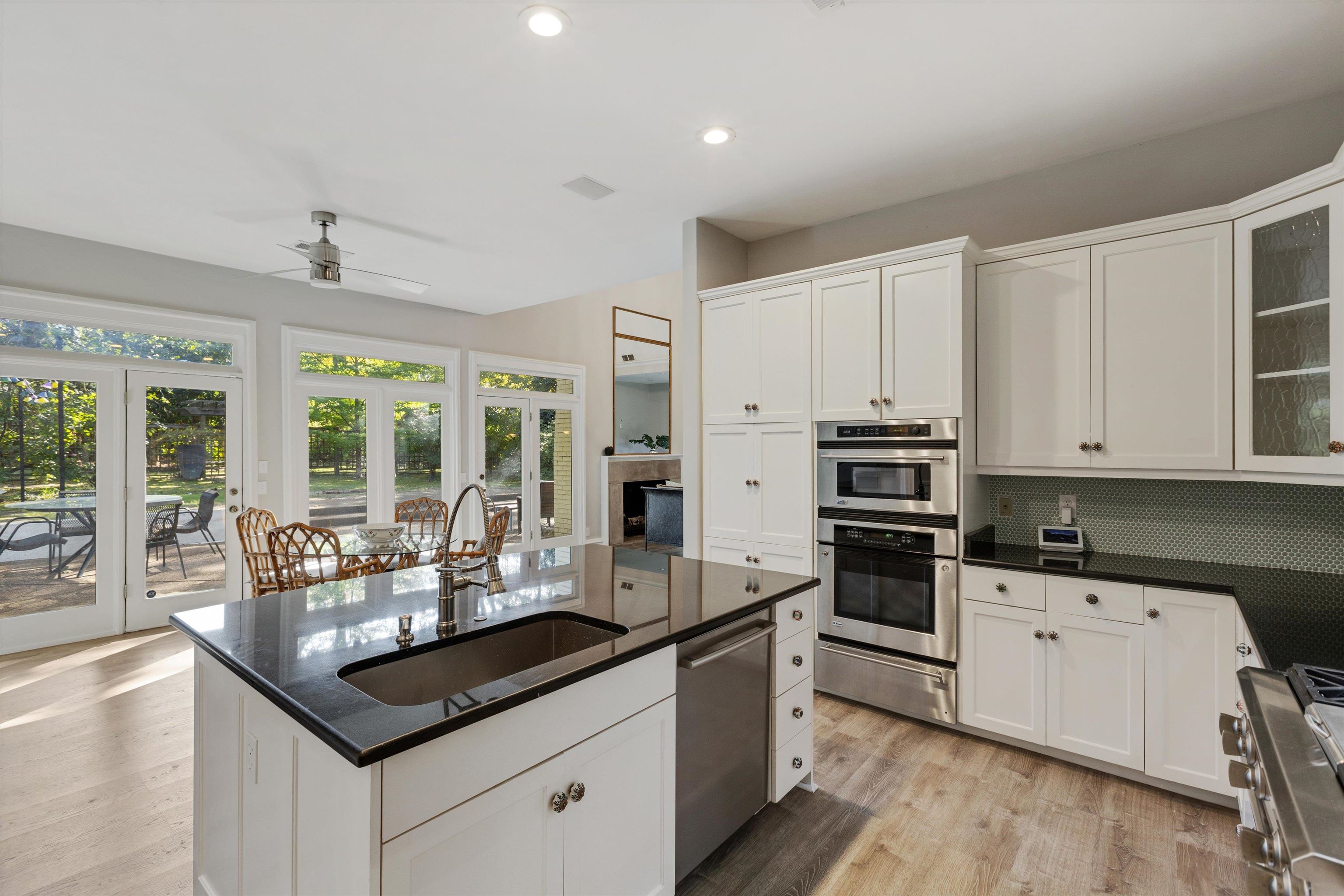 194 South Perkins Road Memphis, TN 38117 - Photo 14 of 33 a kitchen with a stove a sink a refrigerator and cabinets