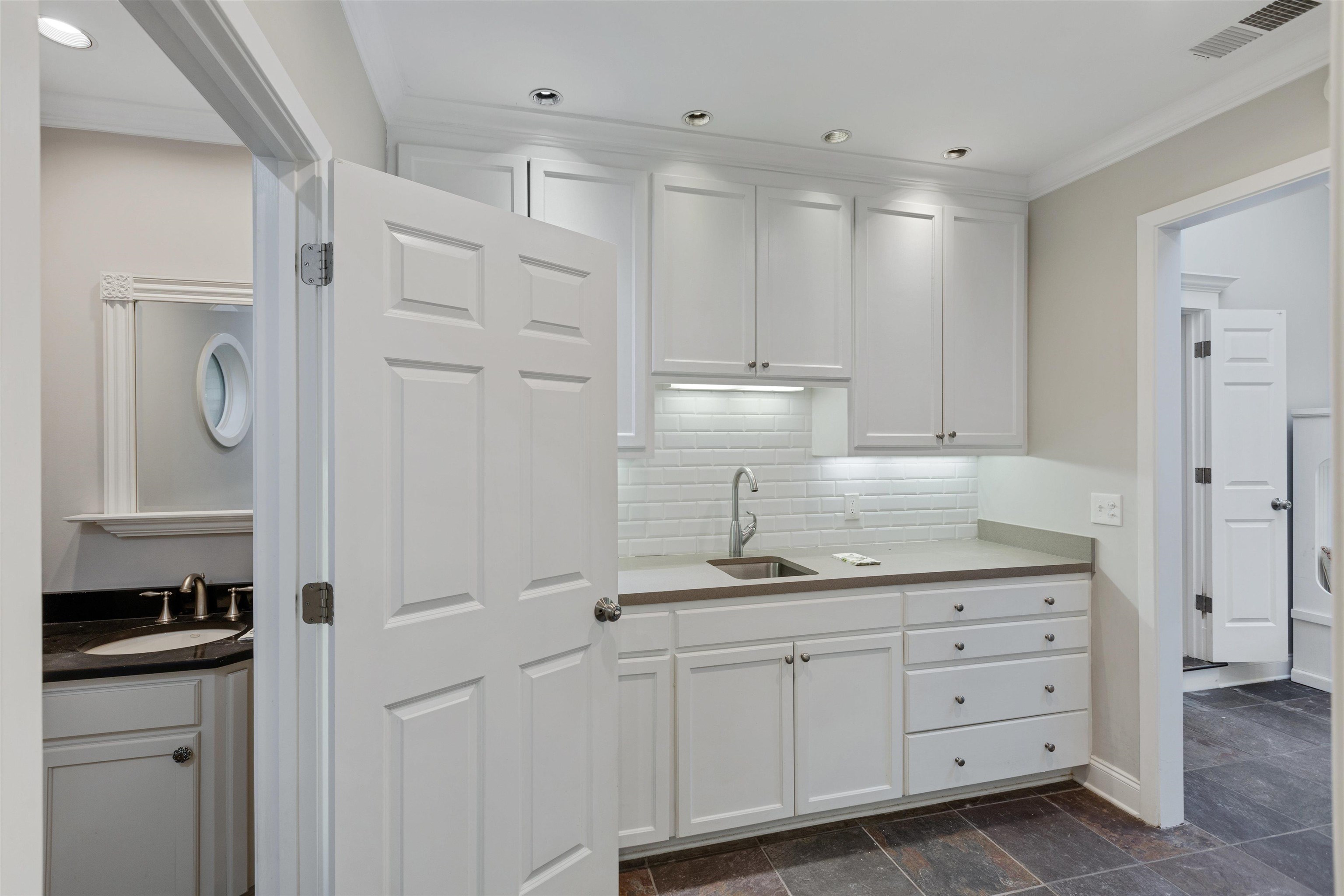 194 South Perkins Road Memphis, TN 38117 - Photo 30 of 33 a kitchen with white cabinets and sink
