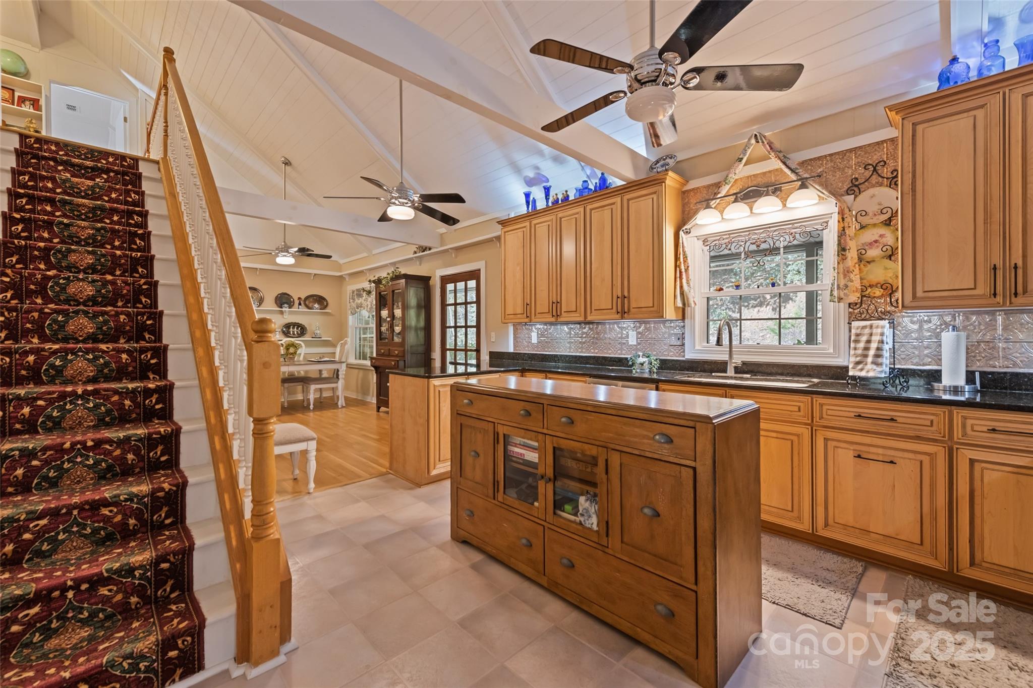 31 Laurel Ridge Drive Otto, NC 28763 - Photo 20 of 48 a large kitchen with stainless steel appliances granite countertop a stove a sink dishwasher and a microwave oven