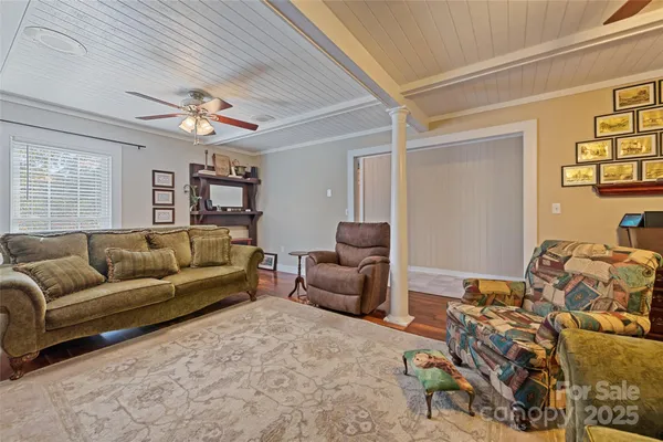 a view of a livingroom with furniture and workspace