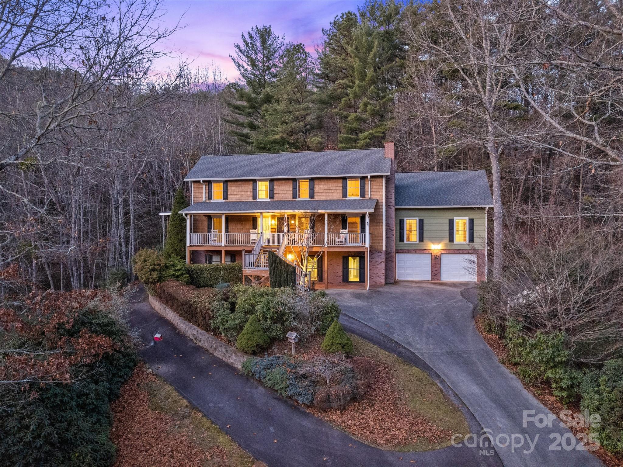 31 Laurel Ridge Drive Otto, NC 28763 - Photo 4 of 48 a front view of a house with garden