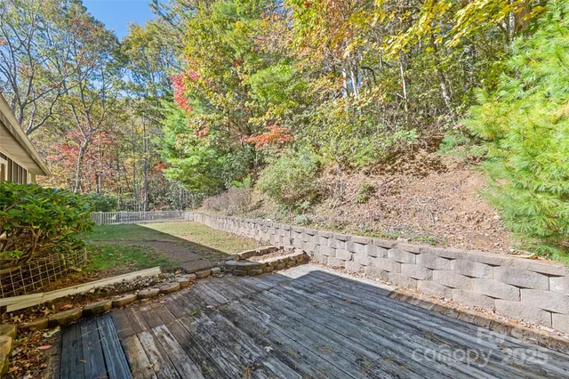 a large kitchen with stainless steel appliances granite countertop a stove a sink dishwasher and a microwave oven